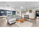 Relaxing living room with L-shaped sofa and wooden floors at 4114 Dove Valley Ln, Lady Lake, FL 32159