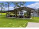 Covered RV storage area with additional space for equipment at 4114 Dove Valley Ln, Lady Lake, FL 32159