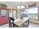Charming dining area with lake view and rustic farmhouse decor at 4114 Dove Valley Ln, Lady Lake, FL 32159
