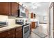 Modern kitchen with stainless steel appliances and wooden cabinets at 4114 Dove Valley Ln, Lady Lake, FL 32159