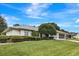 Single-story home with well-maintained lawn at 6435 Borg St, Leesburg, FL 34748
