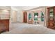 Living room featuring bay window and built-in shelving at 6435 Borg St, Leesburg, FL 34748