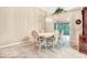 Dining room with tile floor and white wicker chairs at 6435 Borg St, Leesburg, FL 34748