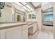 Spacious bathroom with double sinks, a soaking tub, and a separate shower at 6435 Borg St, Leesburg, FL 34748