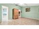 Bedroom with built-in cabinet and access to bathroom at 6435 Borg St, Leesburg, FL 34748