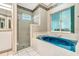 Bathroom features a large garden tub and a separate shower stall at 6435 Borg St, Leesburg, FL 34748