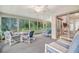 Spacious sunroom with ample seating and views of the backyard at 6435 Borg St, Leesburg, FL 34748
