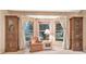 Living area with bay window and built-in cabinetry at 6435 Borg St, Leesburg, FL 34748