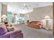 Living room with view into kitchen and sitting area at 6435 Borg St, Leesburg, FL 34748