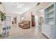 Bright living room with tile floors and views into the dining area at 6435 Borg St, Leesburg, FL 34748