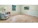 Bright bedroom with tiled floors and a comfortable armchair at 6435 Borg St, Leesburg, FL 34748
