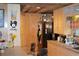 Rustic kitchen with wood cabinets and a black refrigerator at 16640 Ne 148Th Terrace Rd, Fort Mc Coy, FL 32134