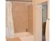 Clean bathroom with tan tile shower/tub combo at 16640 Ne 148Th Terrace Rd, Fort Mc Coy, FL 32134
