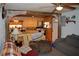 Open living room with view into kitchen and access to back yard at 16640 Ne 148Th Terrace Rd, Fort Mc Coy, FL 32134
