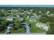 Aerial view of a neighborhood with various houses at 17574 Se 106Th Ave, Summerfield, FL 34491