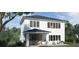 Two-story home with covered patio, large windows and backyard at 576 Casey Loop, Mount Dora, FL 32757