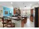Spacious kitchen featuring an island, ample cabinetry, and stainless steel appliances at 7151 Se 173Rd Arlington Loop, The Villages, FL 32162