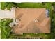 Top-down view of a house roof with surrounding landscaping at 7151 Se 173Rd Arlington Loop, The Villages, FL 32162