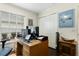 Home office with wood desk and ample storage at 7151 Se 173Rd Arlington Loop, The Villages, FL 32162