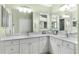 Bathroom with double vanity and large mirror at 7151 Se 173Rd Arlington Loop, The Villages, FL 32162