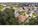 Aerial view of a house with a backyard and a neighborhood in the background at 7151 Se 173Rd Arlington Loop, The Villages, FL 32162