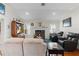 Spacious living room with hardwood floors, fireplace and comfortable leather recliners at 7151 Se 173Rd Arlington Loop, The Villages, FL 32162