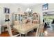 Formal dining room with a glass-top table and elegant cabinetry at 7151 Se 173Rd Arlington Loop, The Villages, FL 32162