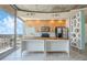 Modern kitchen with light wood cabinets, stainless steel appliances, and marble countertops at 155 S Court Ave # 1507, Orlando, FL 32801