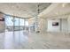 Open concept living room with marble floors, city views, and modern chandelier at 155 S Court Ave # 1507, Orlando, FL 32801
