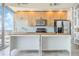 Modern kitchen with light wood cabinets, stainless steel appliances, and marble countertops at 155 S Court Ave # 1507, Orlando, FL 32801