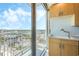 Modern kitchen with city views and a sleek gold faucet at 155 S Court Ave # 1507, Orlando, FL 32801
