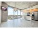 Spacious living area with marble floors, city views, and modern chandelier at 155 S Court Ave # 1507, Orlando, FL 32801