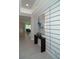 Bright and airy entryway with stylish wall decor and a modern console table at 5143 Firebush Dr, Apopka, FL 32712