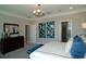 Spacious main bedroom with a dresser and large bed at 5143 Firebush Dr, Apopka, FL 32712