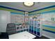Home office with built-in shelving and colorful walls at 5143 Firebush Dr, Apopka, FL 32712