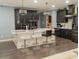 Open concept kitchen with expansive island and sleek, dark cabinetry at 1304 Ocoee Apopka Rd, Ocoee, FL 34761