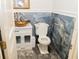 Powder room with a unique vessel sink and marble-like wall at 1304 Ocoee Apopka Rd, Ocoee, FL 34761