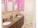 Bathroom with double sinks and granite countertops at 1304 Ocoee Apopka Rd, Ocoee, FL 34761