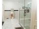 Spa-like bathroom with a large walk-in shower and marble flooring at 1304 Ocoee Apopka Rd, Ocoee, FL 34761