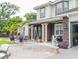 House exterior with a porch and landscaping at 1304 Ocoee Apopka Rd, Ocoee, FL 34761