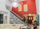 Grand staircase with decorative wall and unique design features at 1304 Ocoee Apopka Rd, Ocoee, FL 34761