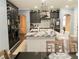 Modern kitchen featuring a large island, dark cabinetry, and wine storage at 1304 Ocoee Apopka Rd, Ocoee, FL 34761