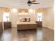 Spacious main bedroom with a large bed and plenty of natural light at 1304 Ocoee Apopka Rd, Ocoee, FL 34761