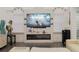 Living room with electric fireplace, large TV, and comfortable seating at 1304 Ocoee Apopka Rd, Ocoee, FL 34761