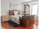 Main bedroom with a large bed and hardwood floors at 1304 Ocoee Apopka Rd, Ocoee, FL 34761