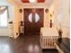 Grand entryway with double doors and hardwood floors at 1304 Ocoee Apopka Rd, Ocoee, FL 34761