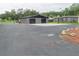 Detached two-car garage with large concrete driveway at 1817 Demastus Ln, Ocoee, FL 34761