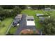 Aerial view showing a house, detached garage, and large backyard at 1817 Demastus Ln, Ocoee, FL 34761