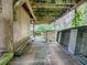 Covered porch with wooden decking and boat storage at 853 Cr 484, Lake Panasoffkee, FL 33538