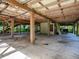 Unfinished basement with concrete floor and wooden beams at 853 Cr 484, Lake Panasoffkee, FL 33538